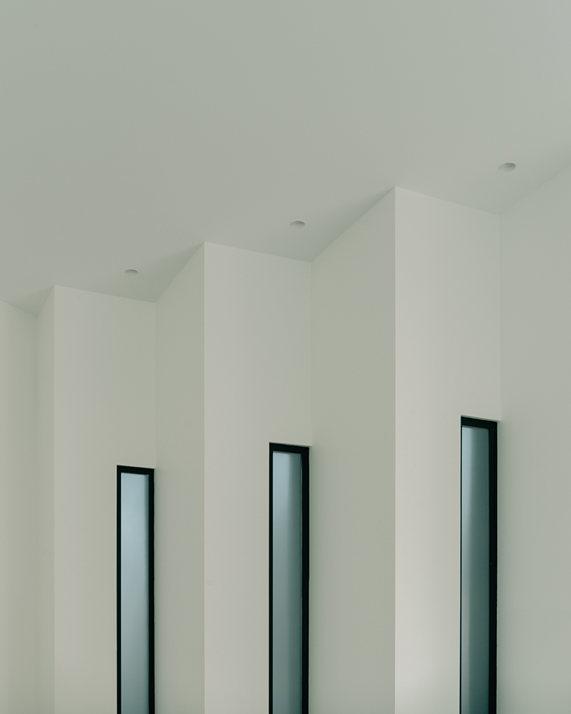 serrated charred wood shell encloses suburban residence on the hills of tbilisi