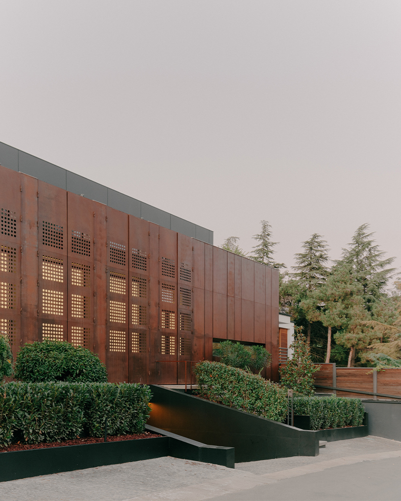 punctured iron doors shape kinetic facade by TIMM architecture in tbilisi - 3