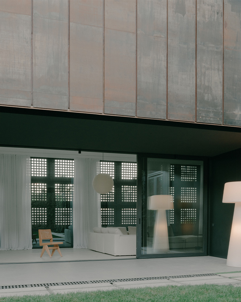 punctured iron doors shape kinetic facade by TIMM architecture in tbilisi - 8