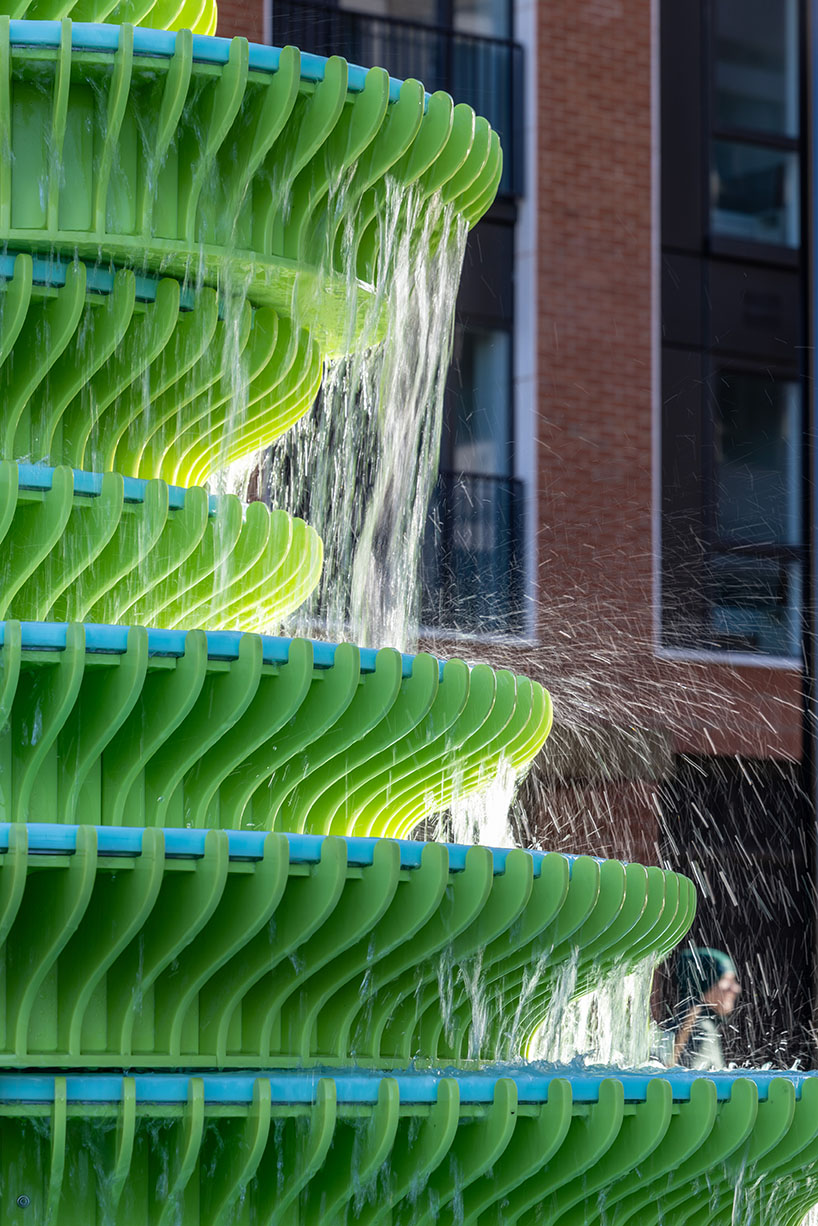 NEON stacks sculptural plates into bright green asymmetrical fountain in london