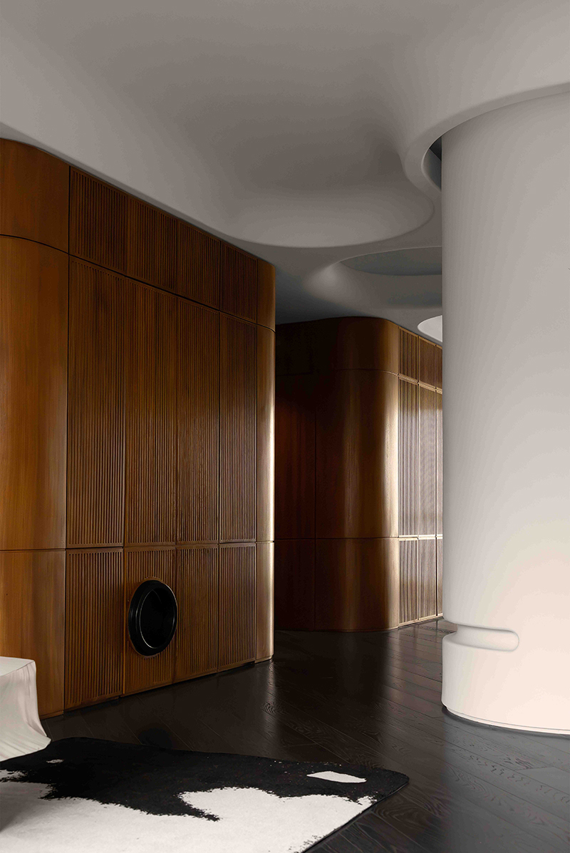 teakwood clads the interior of jackie xu residence in shanghai dedicated to owner's dogs