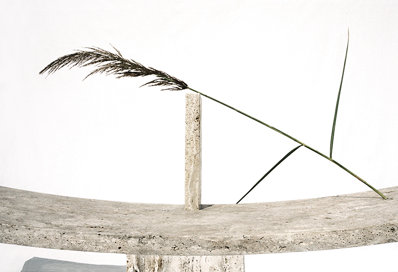 leonardo talarico handcrafts monolithic benches and fountains from tuscan travertine