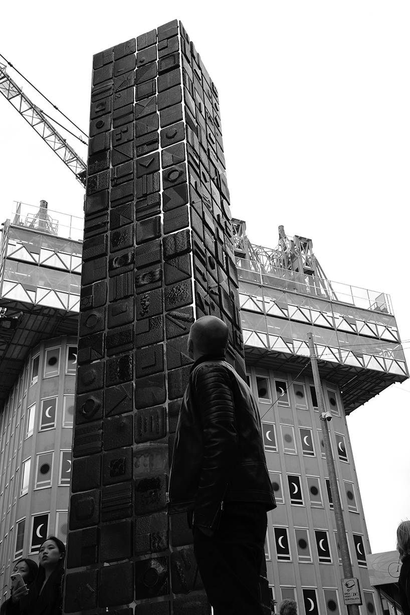 repurposed lava stones set up nerosicilia re-design tower installation for milan design week