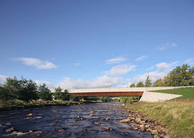 moxon's new granite and steel bridge in rural scotland stands alongside historic crossing