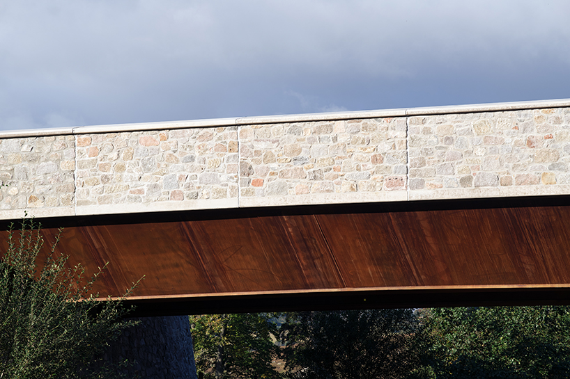 moxon's new granite and steel bridge in rural scotland stands alongside historic crossing