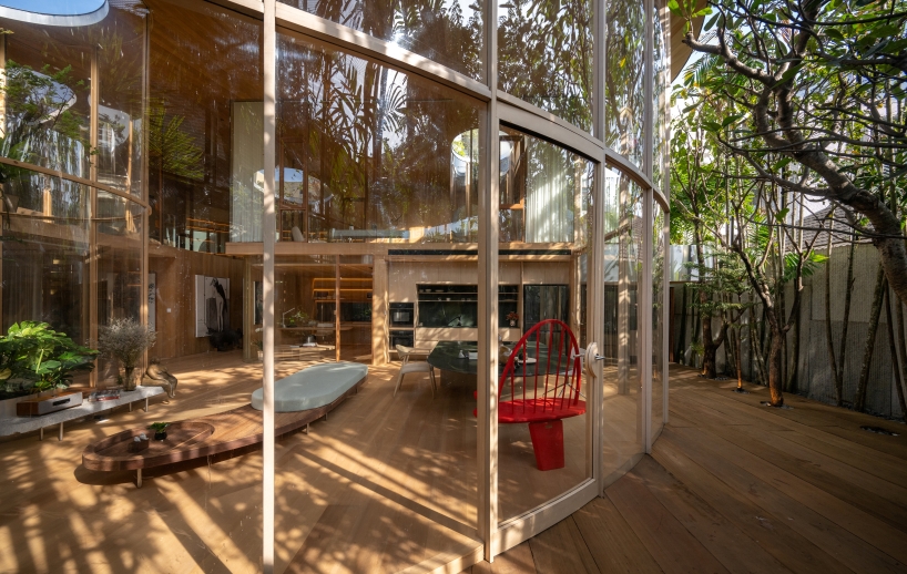 curved glass atriums penetrate residence&rsquo;s aluminum roof in bangkok