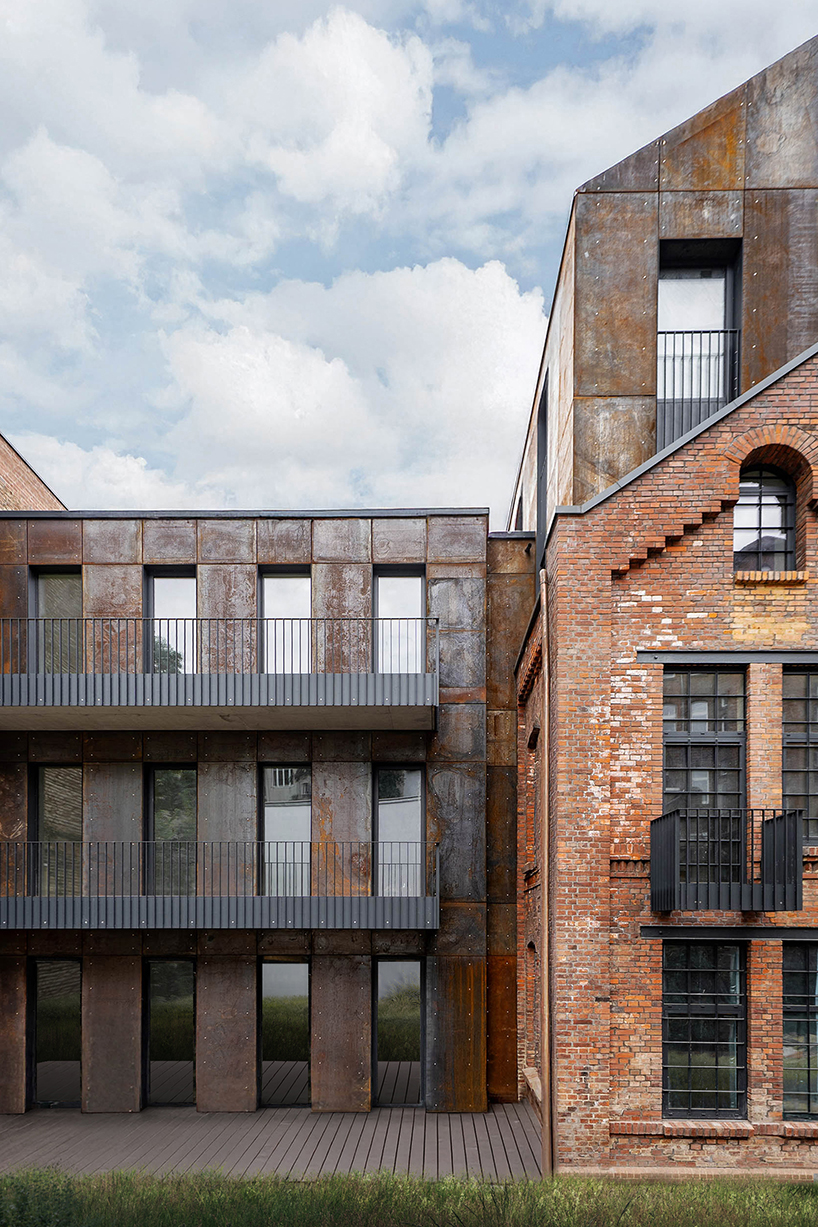 corten steel extends former laundry complex&rsquo;s brick buildings in kassel