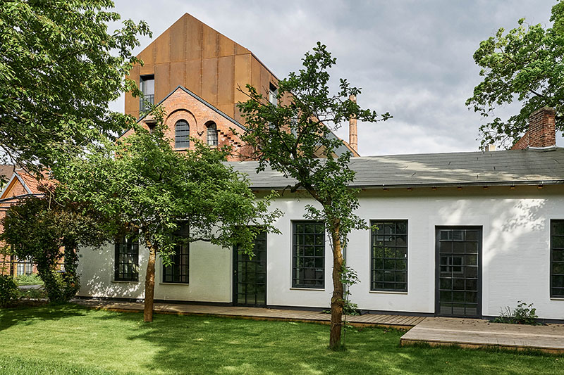 corten steel extends former laundry complex&rsquo;s brick buildings in kassel
