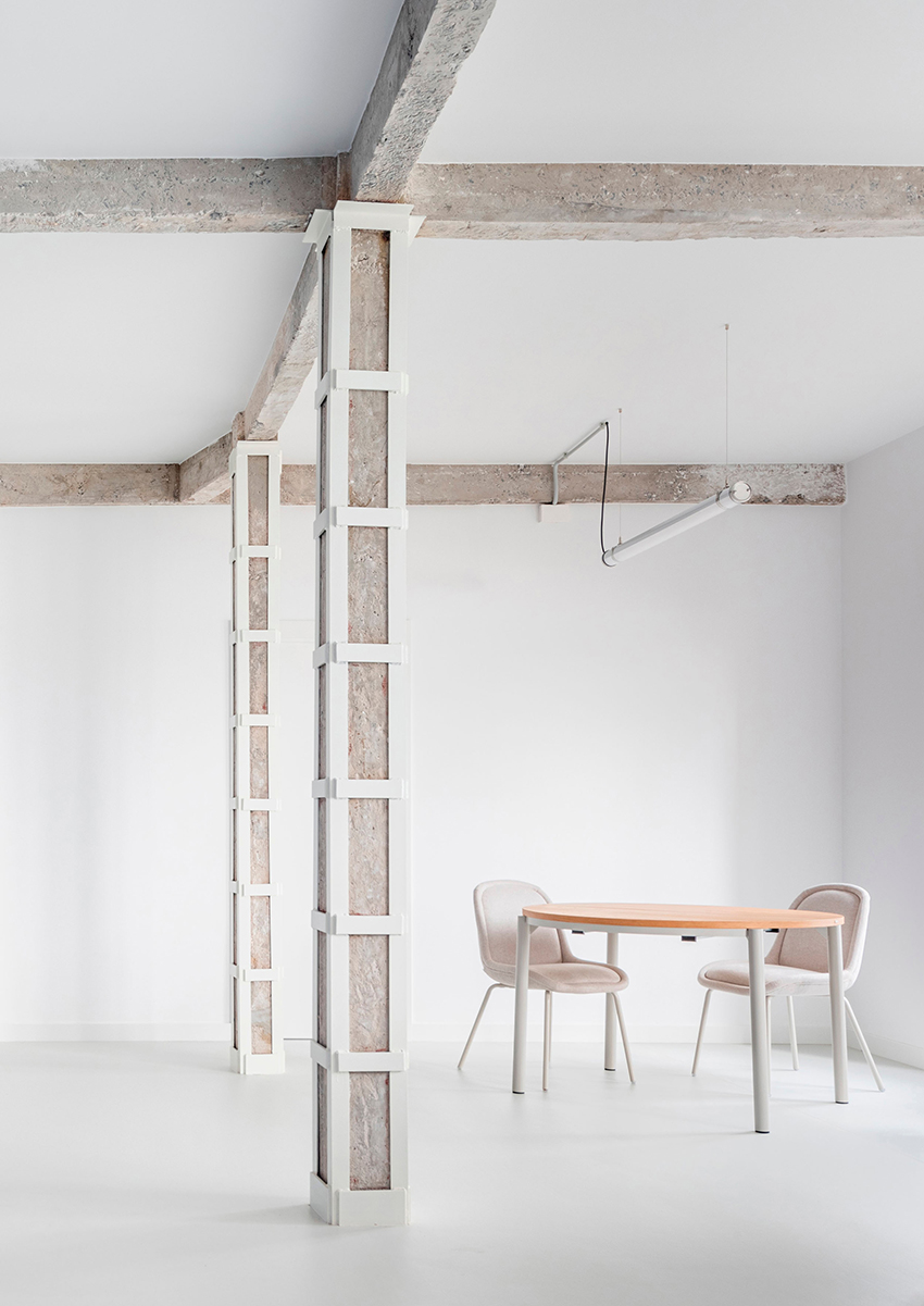 blue and white interiors link renovated 1930s apartment to its seaside setting in spain