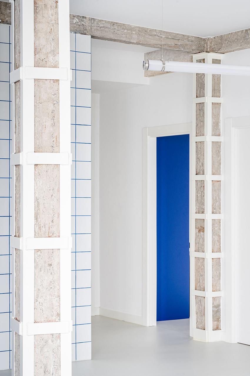 blue and white interiors link renovated 1930s apartment to its seaside setting in spain