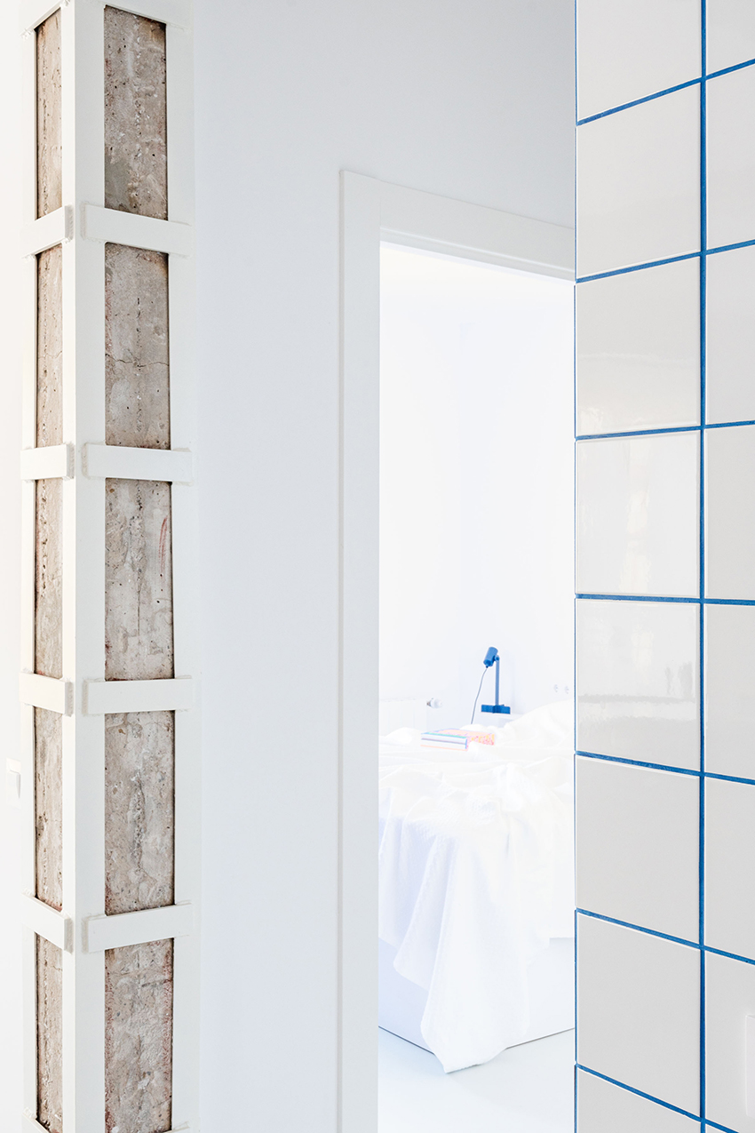 blue and white interiors link renovated 1930s apartment to its seaside setting in spain