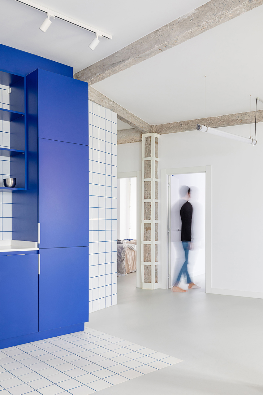 blue and white interiors link renovated 1930s apartment to its seaside setting in spain