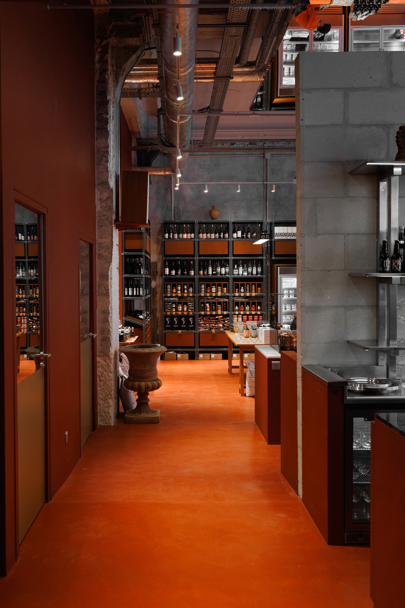 red floor anchors parisian restaurant ypseli with steel and marble textures - 6
