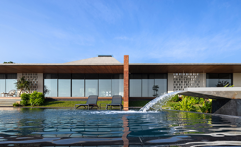 wooden pyramid skylight illuminates suoi hai villa's interior in vietnam