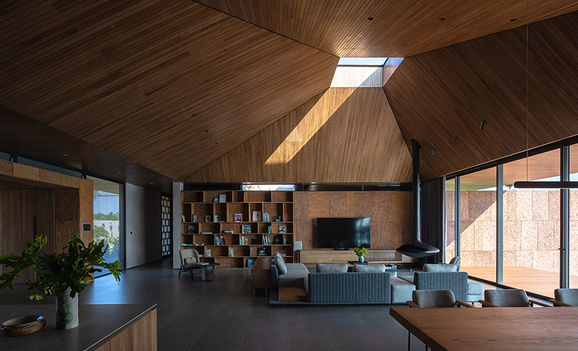 wooden pyramid skylight illuminates suoi hai villa's interior in vietnam