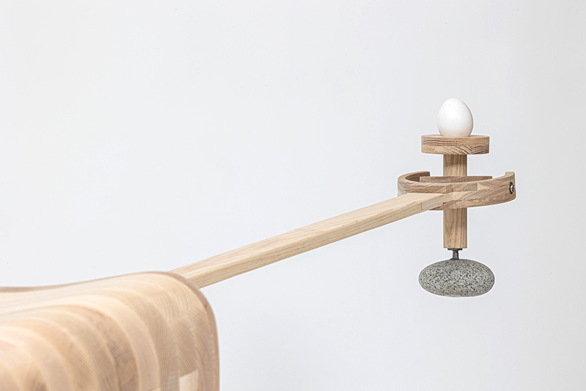 ahn kihyun’s playful performative chair is intersected by a gimbal structure to balances eggs