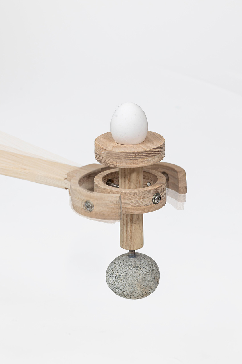 ahn kihyun’s playful performative chair is intersected by a gimbal structure to balances eggs
