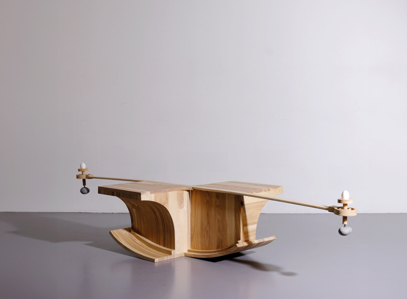 halfway serious wooden chair transforms sitting into a performative act of balance