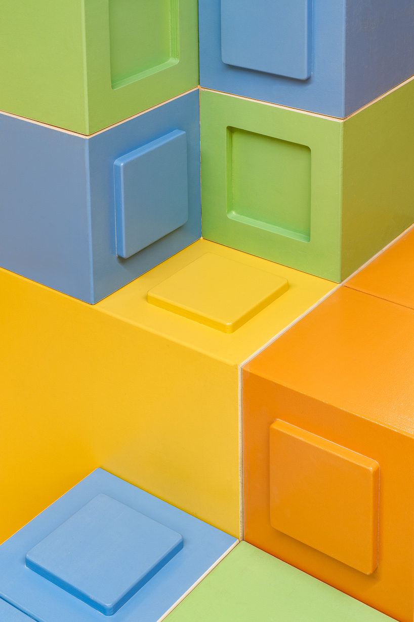 modular furniture pieces assemble to form varying play scenarios within lisbon-based school