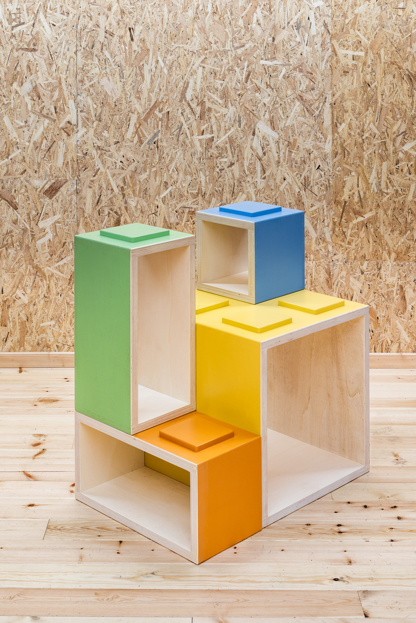 modular furniture pieces assemble to form varying play scenarios within lisbon-based school