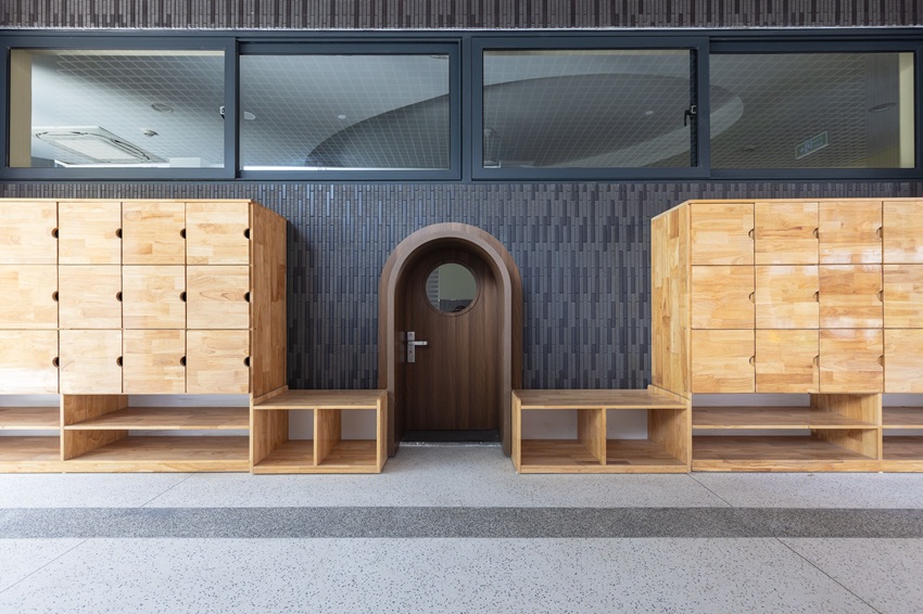 elliptical classroom volumes and colorful louvers shape courtyard kindergarten in hanoi - 6