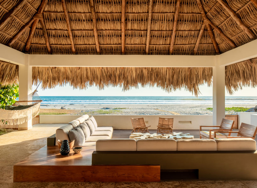 straw roof crowns coral house by elástica studio on el salvador's seaside
