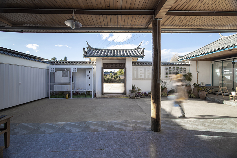 modular cabins made of aluminum and glass embed into village houses of rural china