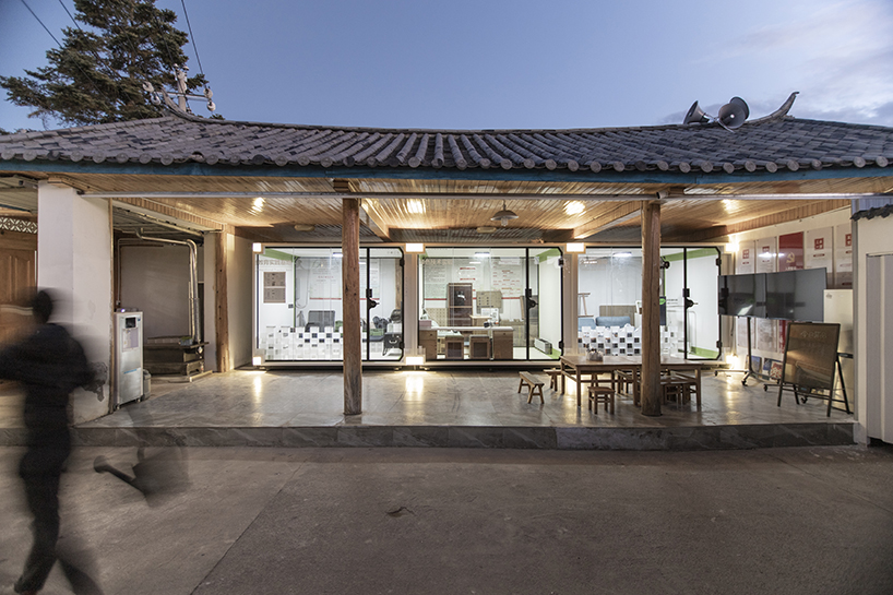 modular cabins made of aluminum and glass embed into village houses of rural china