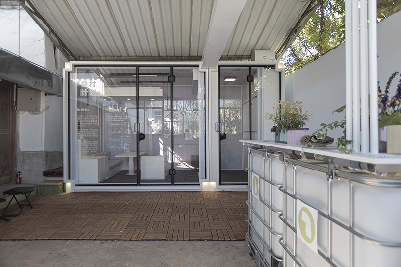 modular cabins made of aluminum and glass embed into village houses of rural china