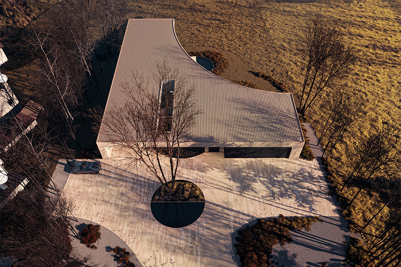 vertically laid bricks clad dune house's curved volume by reform architekt in poland