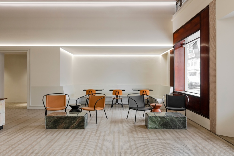 jujurwork revives malaysian heritage building as cafe with repurposed onyx installation