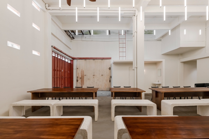 jujurwork revives malaysian heritage building as cafe with repurposed onyx installation