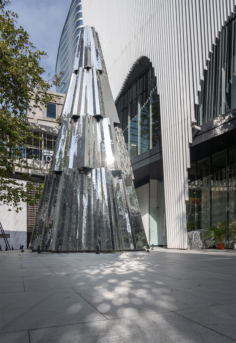 sanitas studio's installations juxtapose contemplative mirrors and earth in bangkok