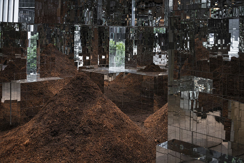 sanitas studio's installations juxtapose contemplative mirrors and earth in bangkok