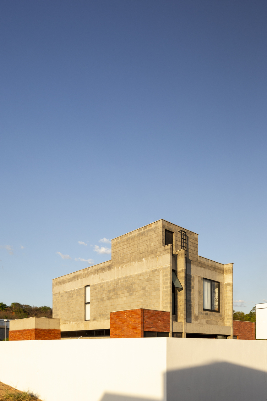 Red Brick And Concrete Stacked Blocks Shape Vão House In Brazil