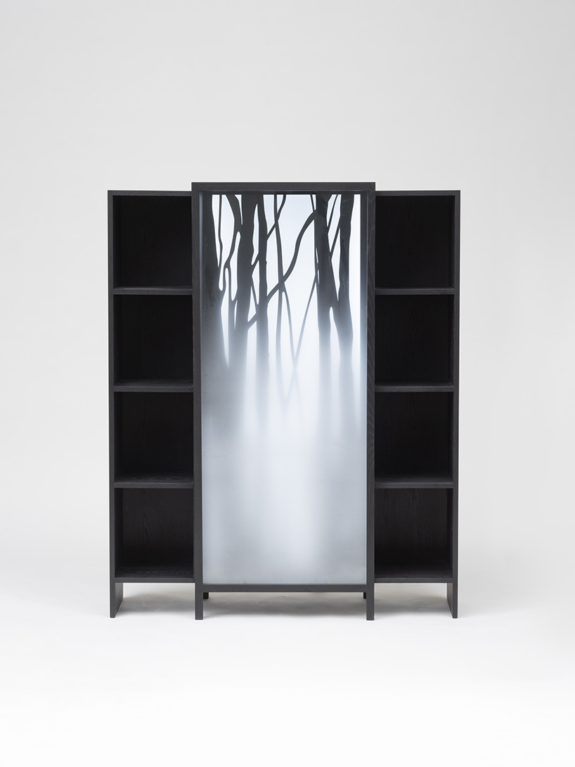 jisu kim's sliding ash wood bookshelf captures the icy chill of a winter forest
