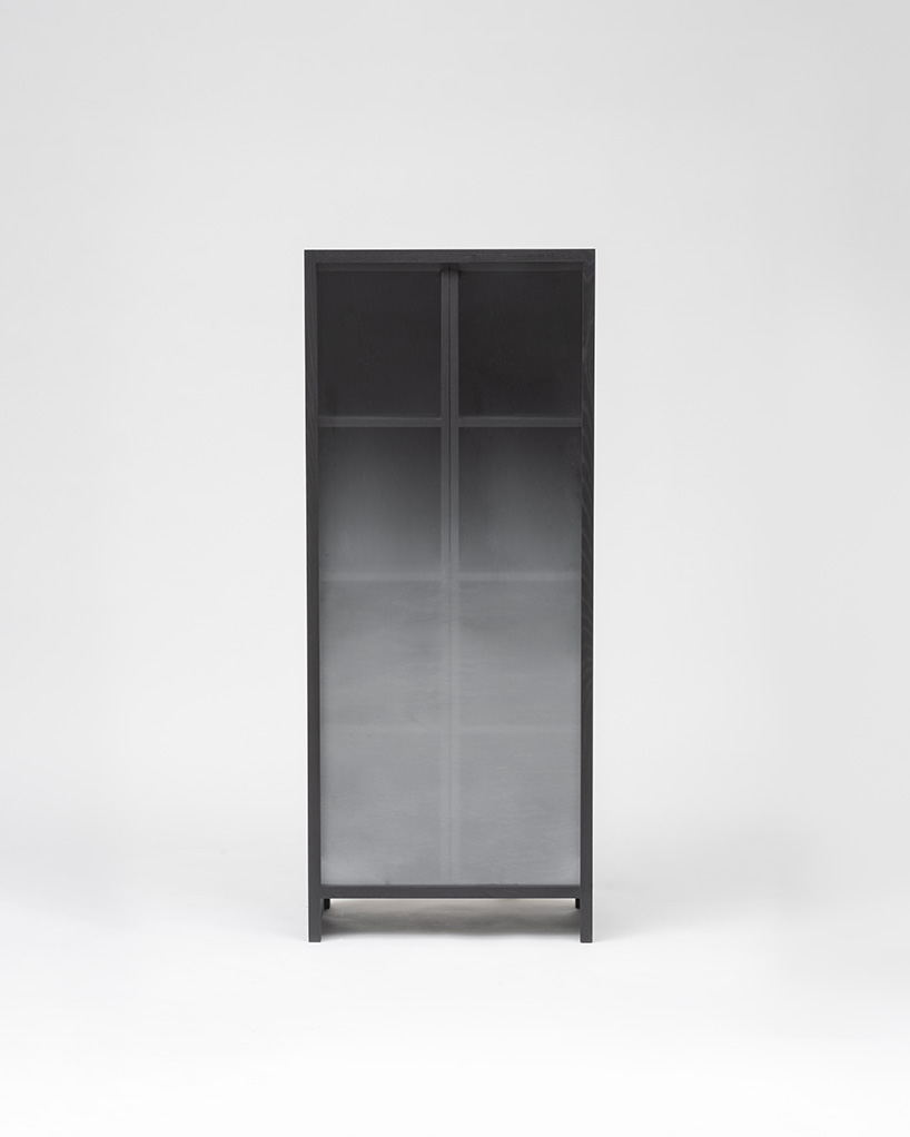 jisu kim's sliding ash wood bookshelf captures the icy chill of a winter forest