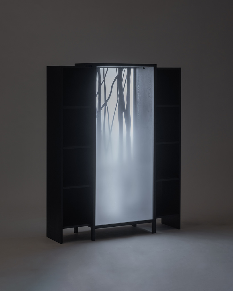 jisu kim's sliding ash wood bookshelf captures the icy chill of a winter forest