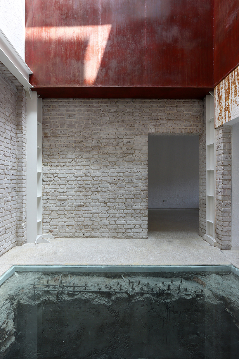 sculptural steel staircase and wall breathes new life into iranian poet&rsquo;s 1970s home