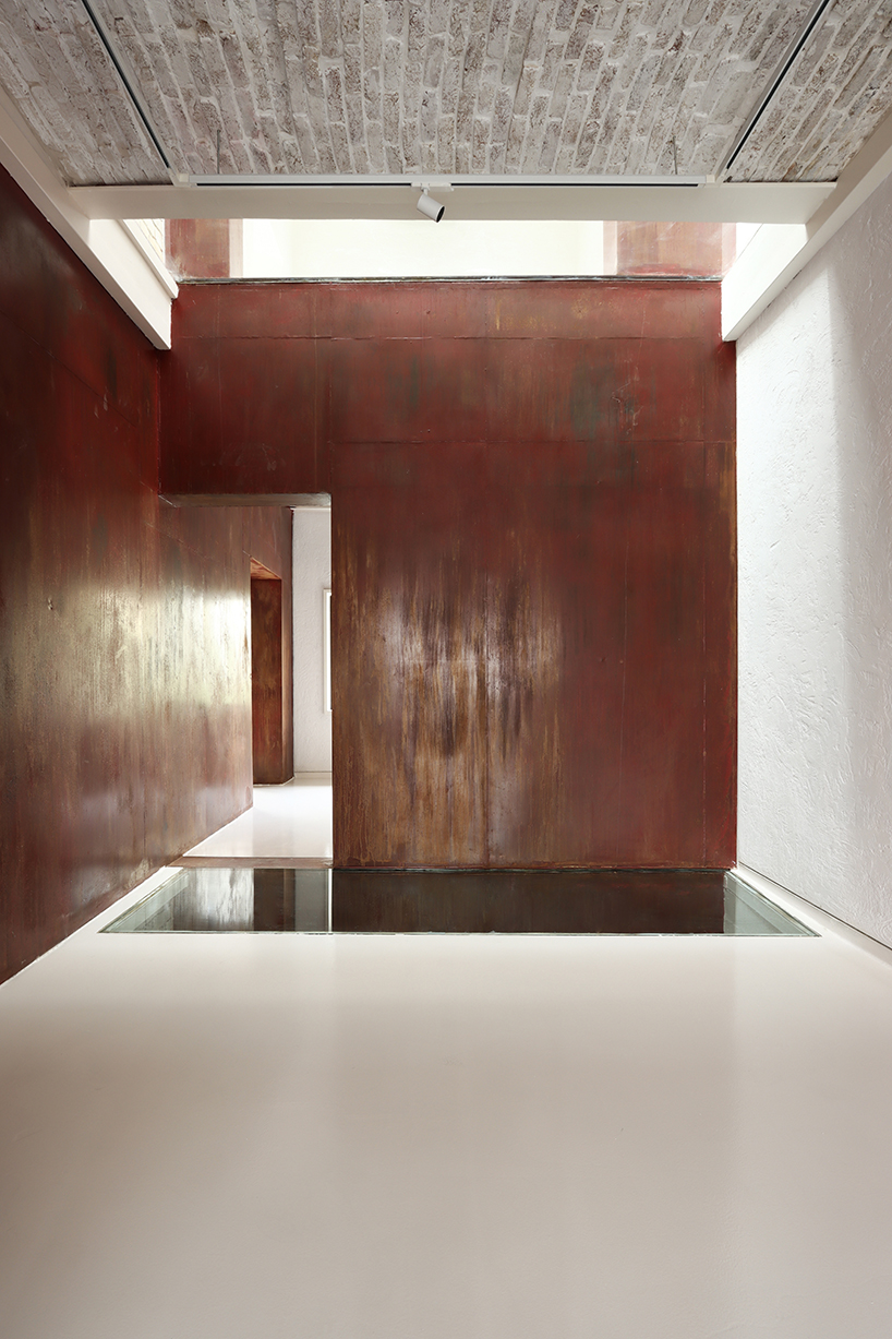 sculptural steel staircase and wall breathes new life into iranian poet&rsquo;s 1970s home