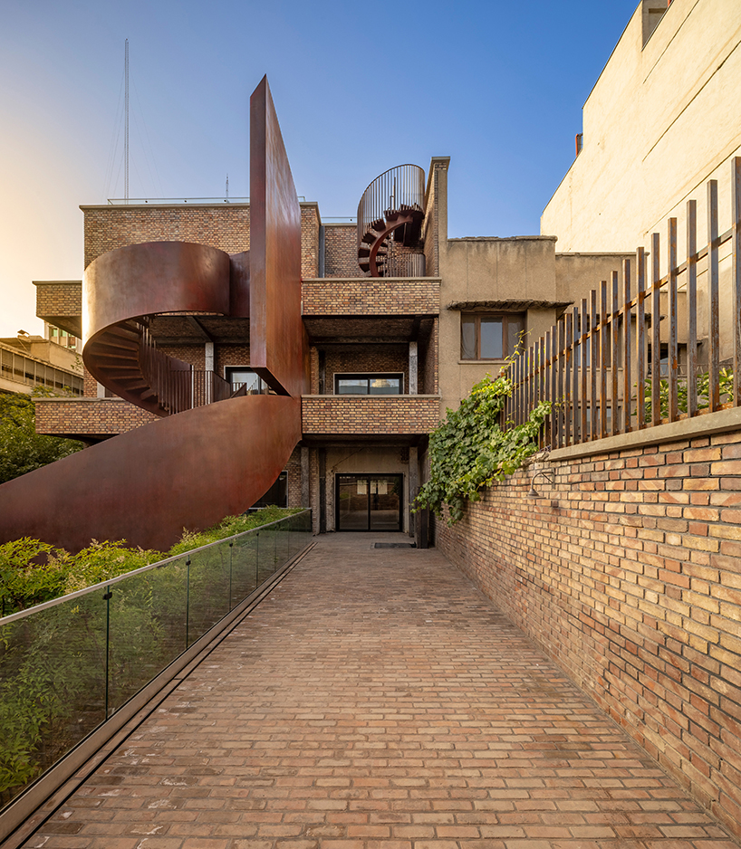 sculptural steel staircase and wall breathes new life into iranian poet&rsquo;s 1970s home