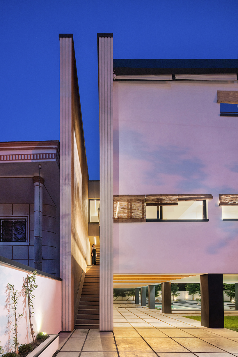 long white curtains cover samon villa's entire open facade in northern iran