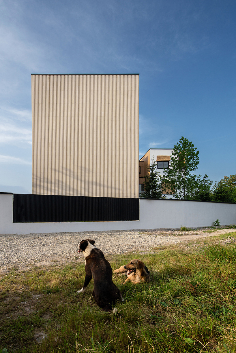long white curtains cover samon villa's entire open facade in northern iran