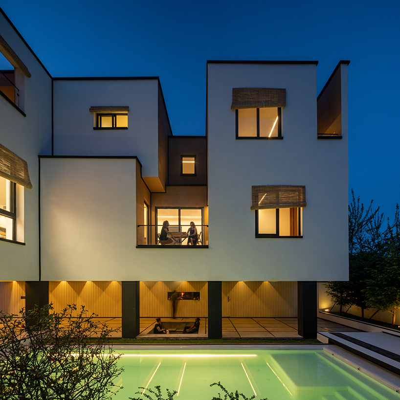 long white curtains cover samon villa's entire open facade in northern iran