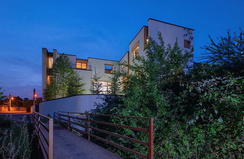 long white curtains cover samon villa's entire open facade in northern iran