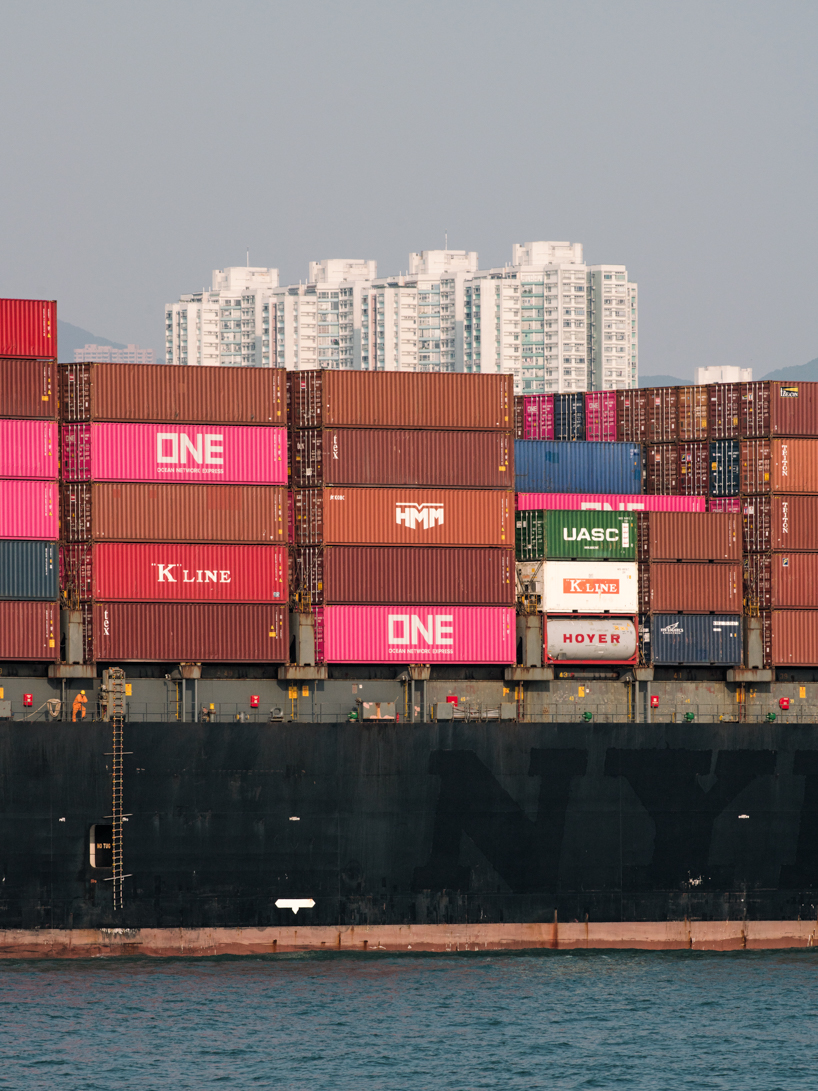 photographer captures cargo ships passing by on his ferry ride home