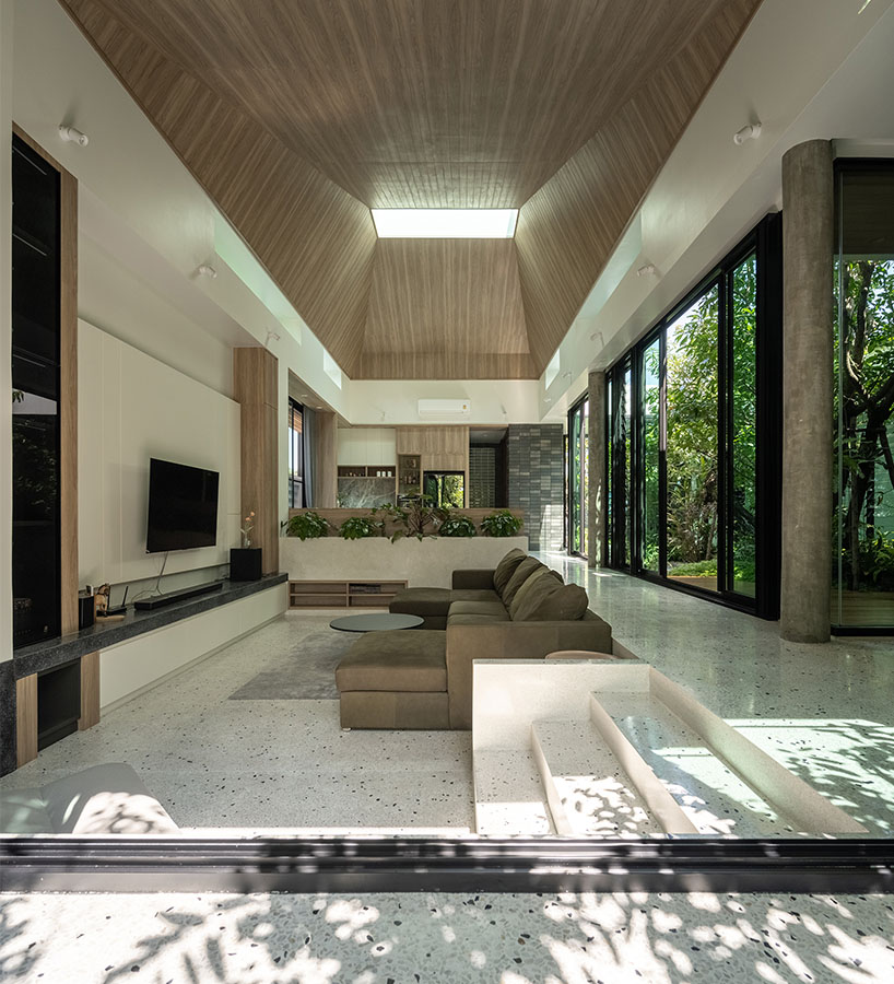 seven interconnected courtyards weave greenery into studio bewell's house in bangkok