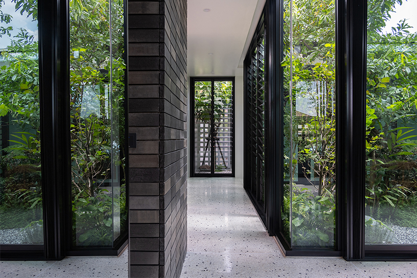 seven interconnected courtyards weave greenery into studio bewell's house in bangkok