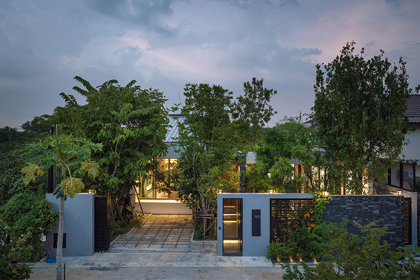 seven interconnected courtyards weave greenery into studio bewell's house in bangkok