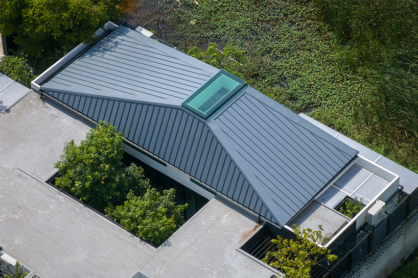 seven interconnected courtyards weave greenery into studio bewell's house in bangkok